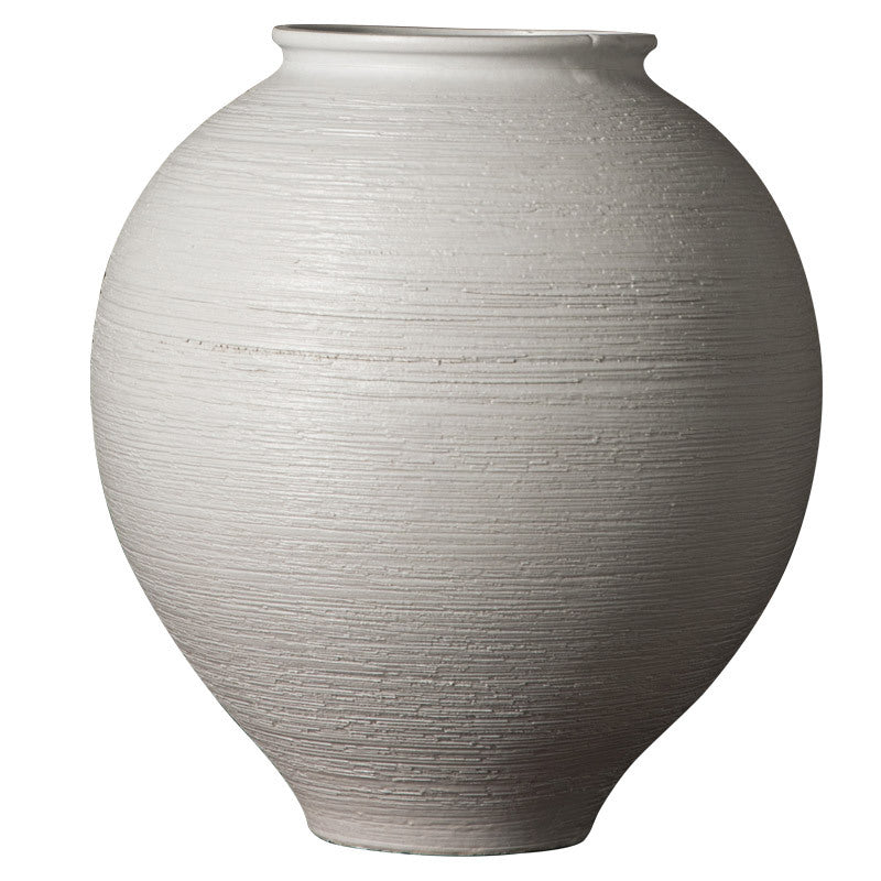 Large white ribbed round ceramic vase isolated on white background