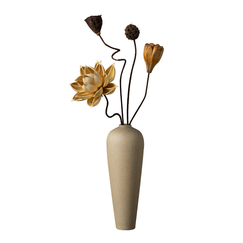 Slim beige coarse-clay bud vase with sculptural dried flower