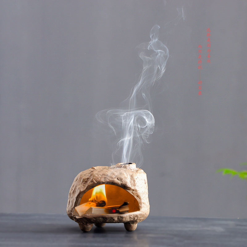 Natural stone cave Palo Santo burner with smoke rising through top vent