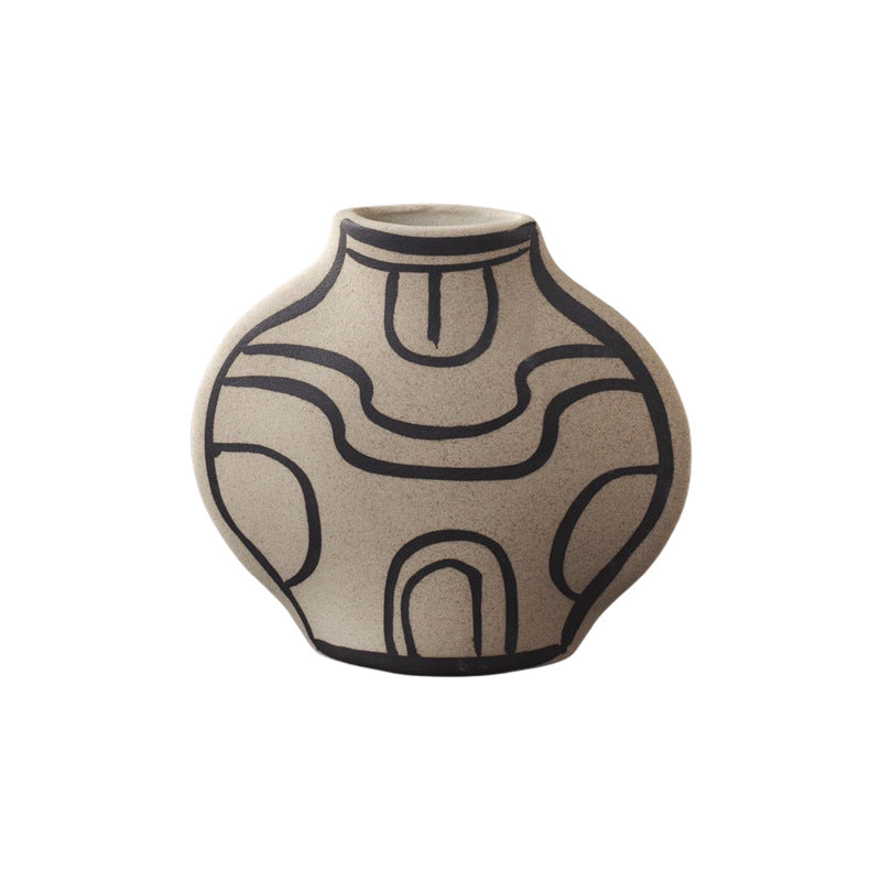 Ivory black-line art round abstract ceramic vase isolated view