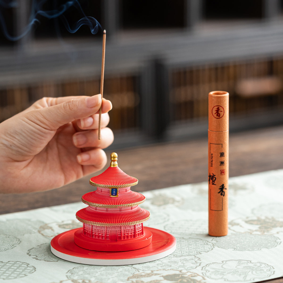 Imperial red Temple of Heaven incense holder in use with stick incense
