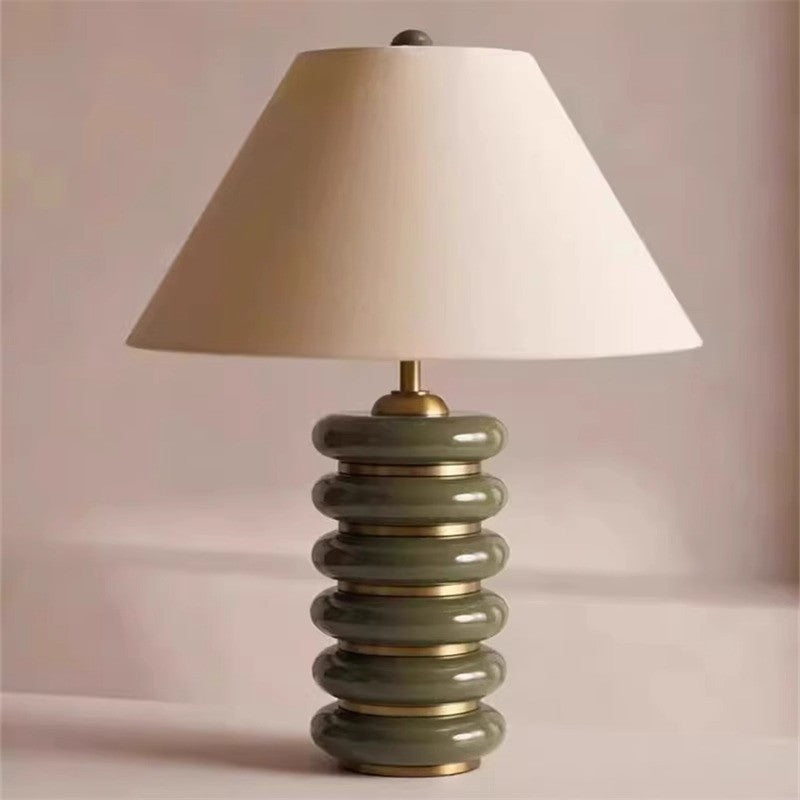 Green stacked disc resin table lamp close front view