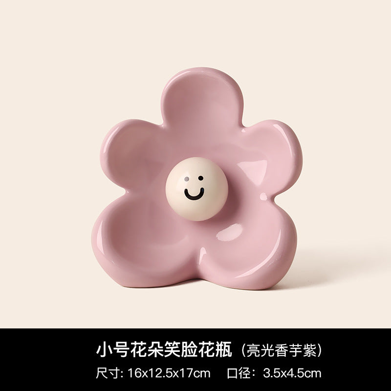 Pink smiley flower ceramic vase with glossy sculptural petals