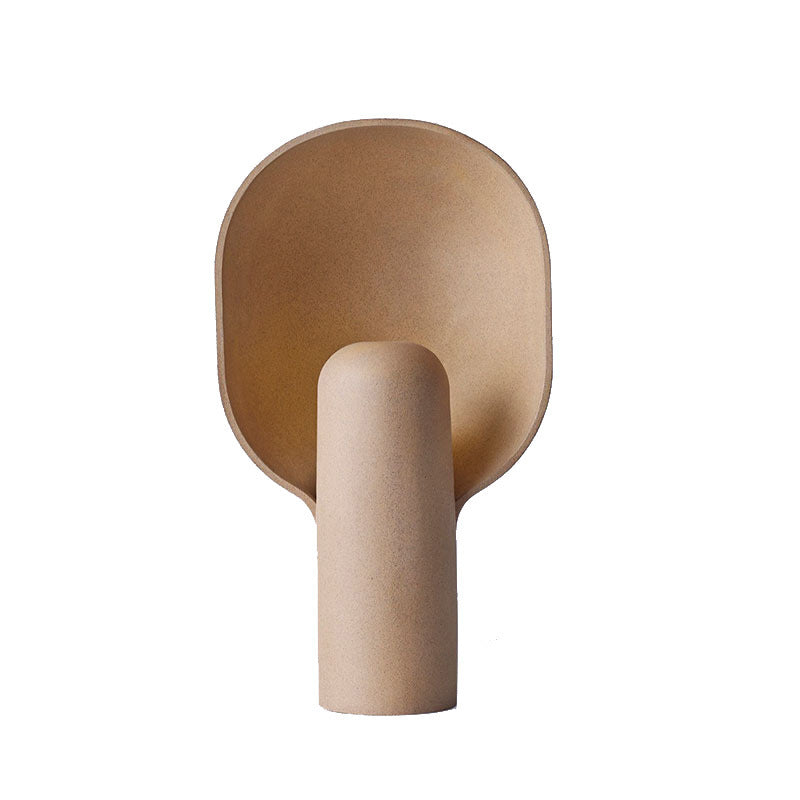 Minimal sculptural beige resin table lamp in modern interior