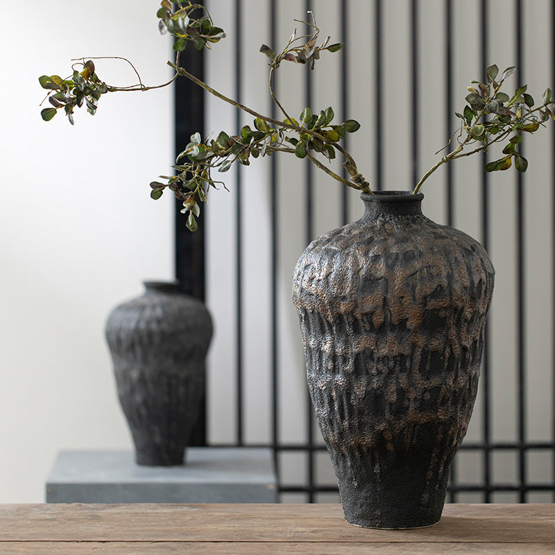 Large charcoal black textured ceramic vase with natural branch