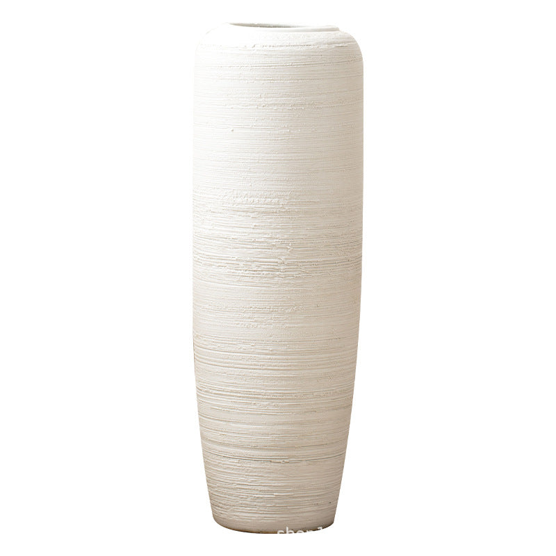 Ivory white tall horizontal ribbed ceramic floor vase isolated view