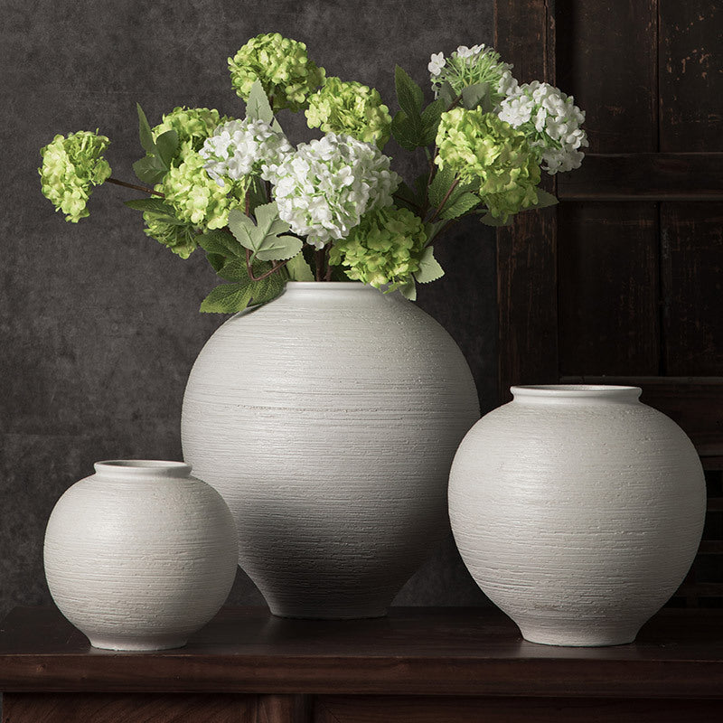 White ribbed round ceramic vase trio styled with green hydrangeas
