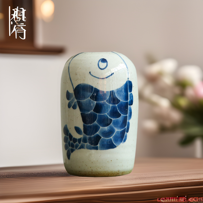 Hand-painted blue white ceramic vase with stylized fish motif