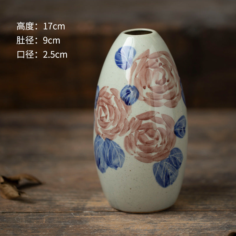 Hand-painted blue white ceramic bud vase with rose motif, 17 cm