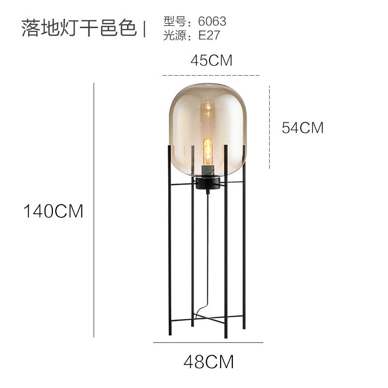 Smoke grey capsule glass floor lamp with black frame