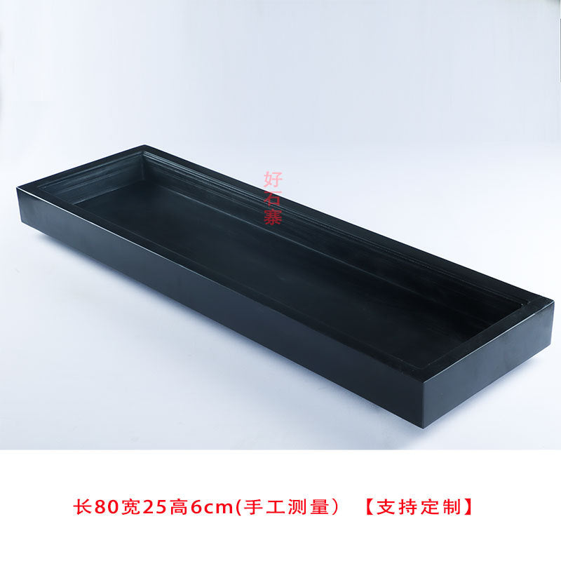Deep black stone landscape tray with broad rectangular opening