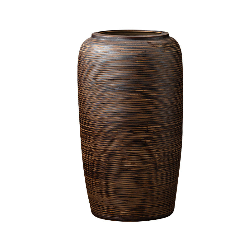 Bronze brown horizontally ribbed ceramic floor vase isolated front view