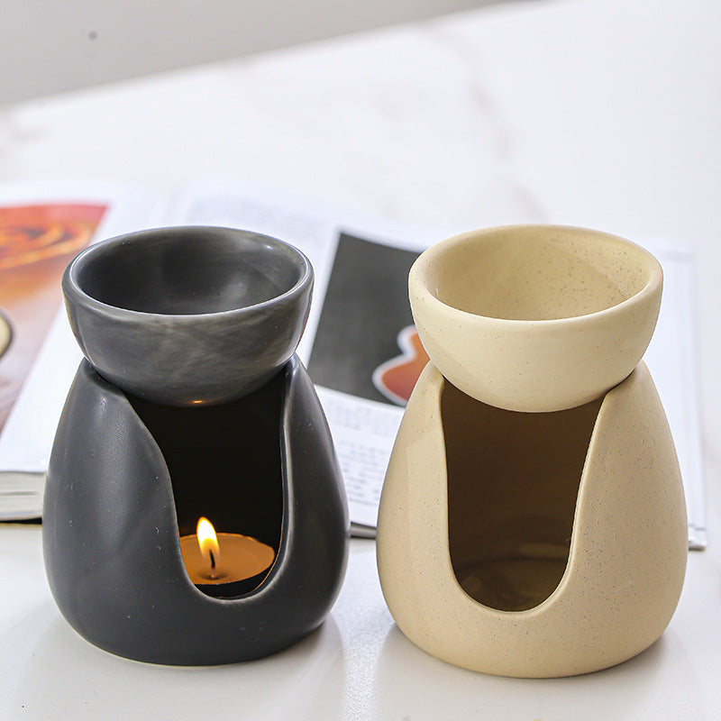 Ceramic candle aroma burner styled in a calm modern interior
