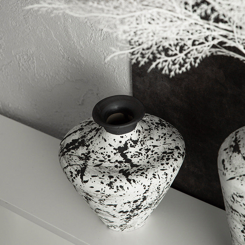 Black and white splatter ceramic vase close-up from above