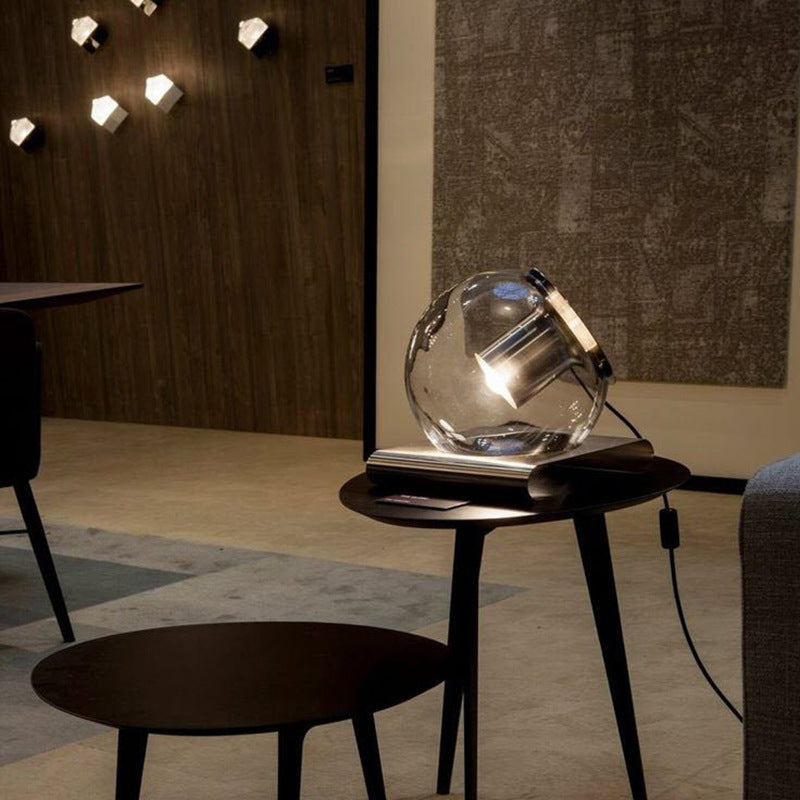 Modern glass sphere art lamp with warm directional glow