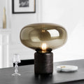 Smoked amber glass mushroom table lamp with black marble cylinder base
