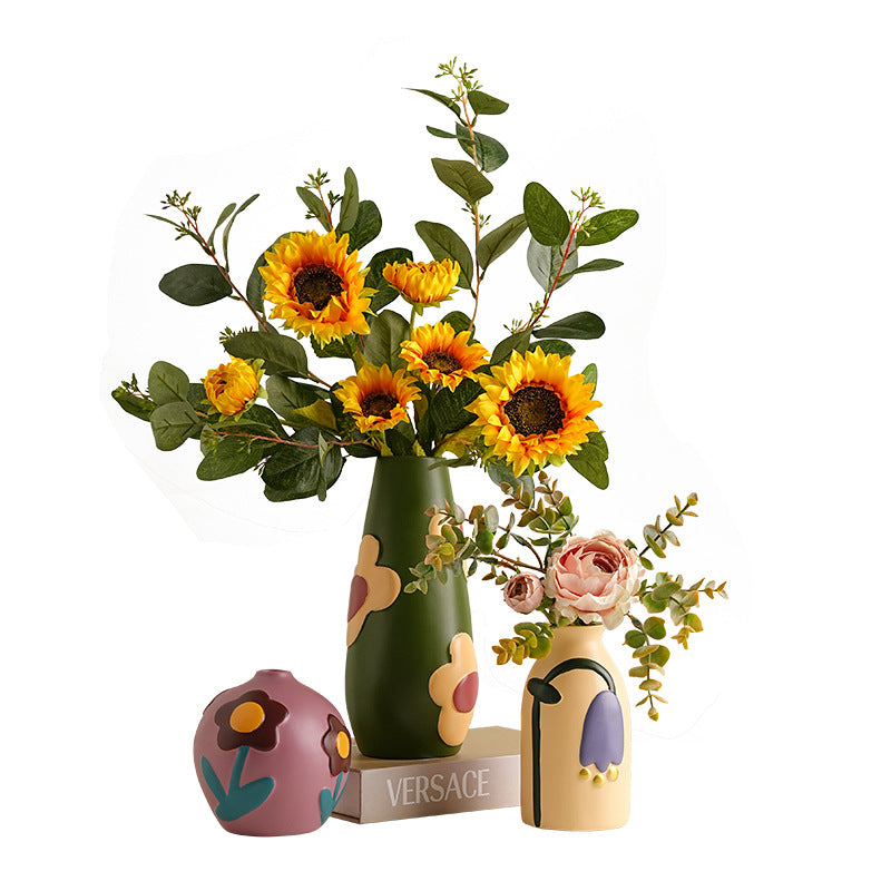 Colorful hand-painted ceramic vase trio styled with sunflower and mixed floral bouquet