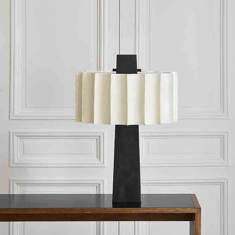 Black and ivory sculptural floor lamp with pleated drum shade