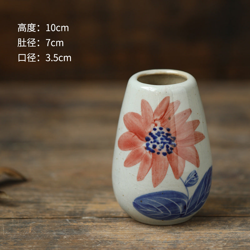 Hand-painted blue white ceramic bud vase with sunflower motif, 10 cm