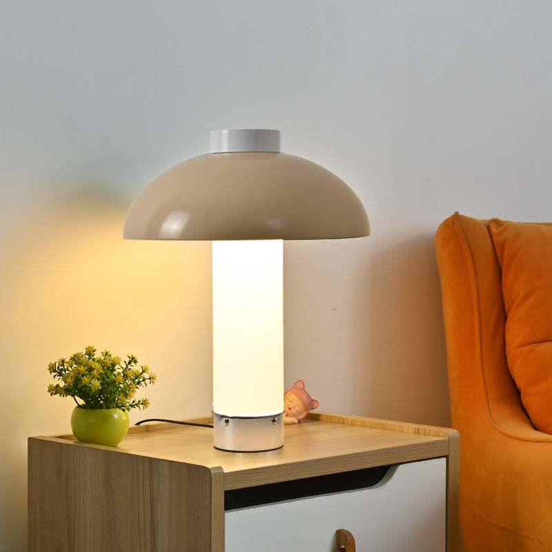 Beige sculptural dome bedside table lamp with glowing column
