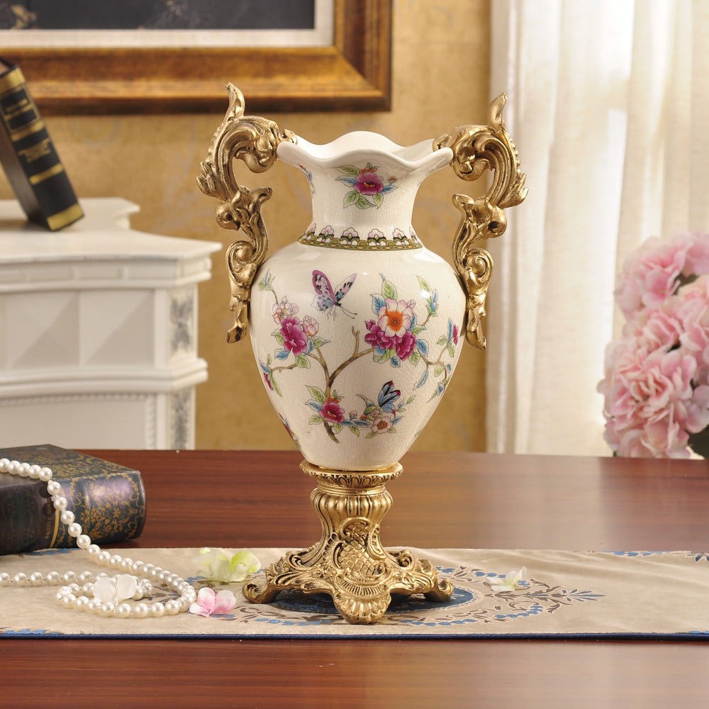 Large double-handle ceramic vase with pink floral pattern styled on console