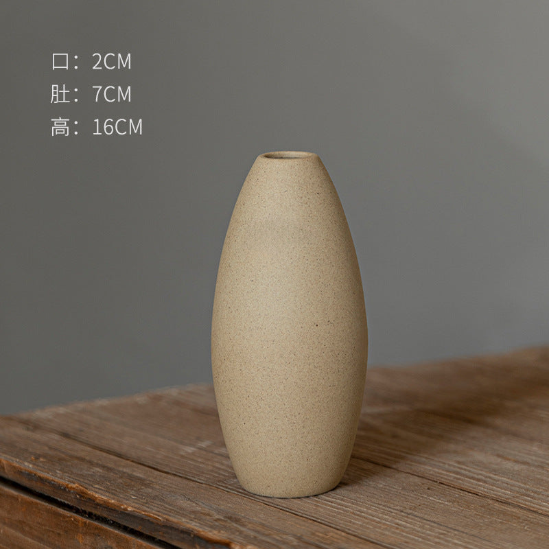 Oval beige coarse-clay ceramic bud vase 16 cm high