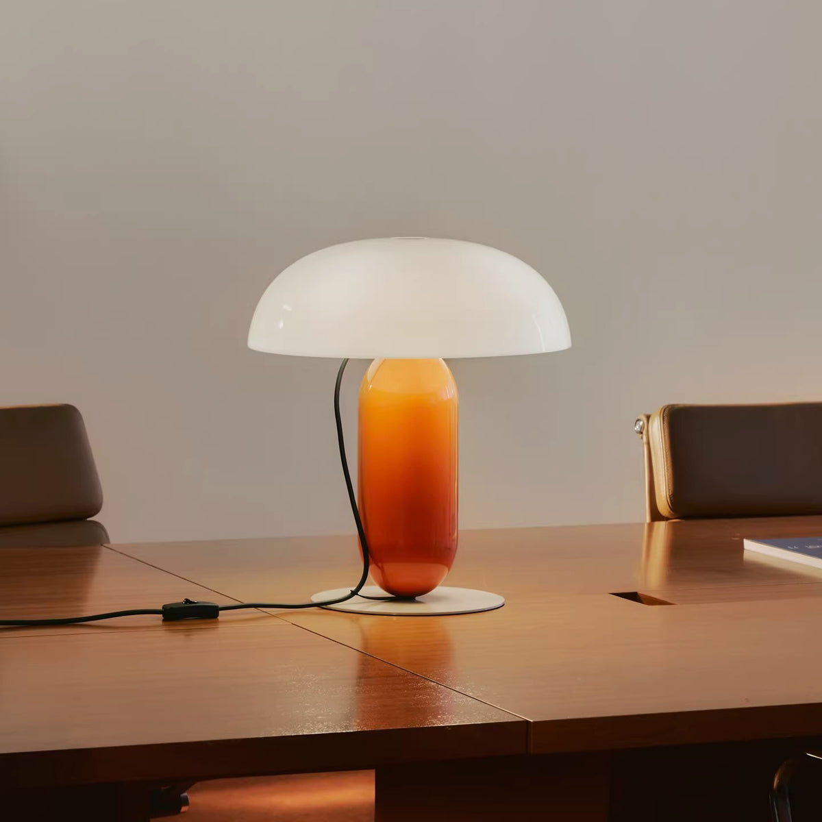 Large opal and orange sculptural table lamp styled on dining table