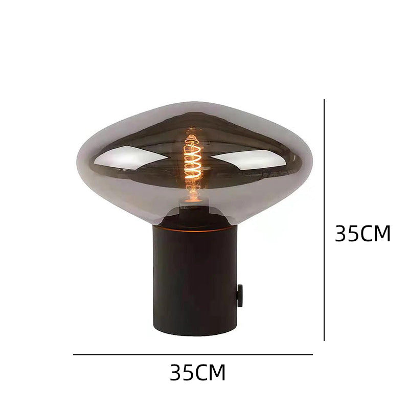 Smoked glass flying saucer table lamp 35cm by 35cm with black cylindrical metal base