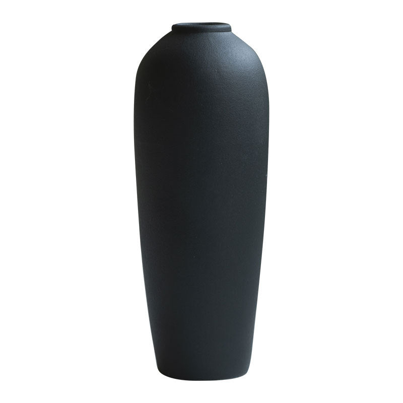 Matte black tall minimalist ceramic vase isolated product view