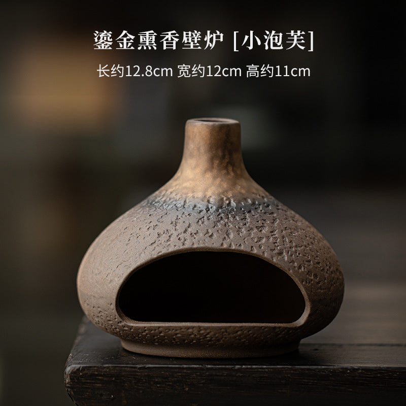 Gilded puff ceramic Palo Santo burner approximately 12.8 by 12 by 11 cm