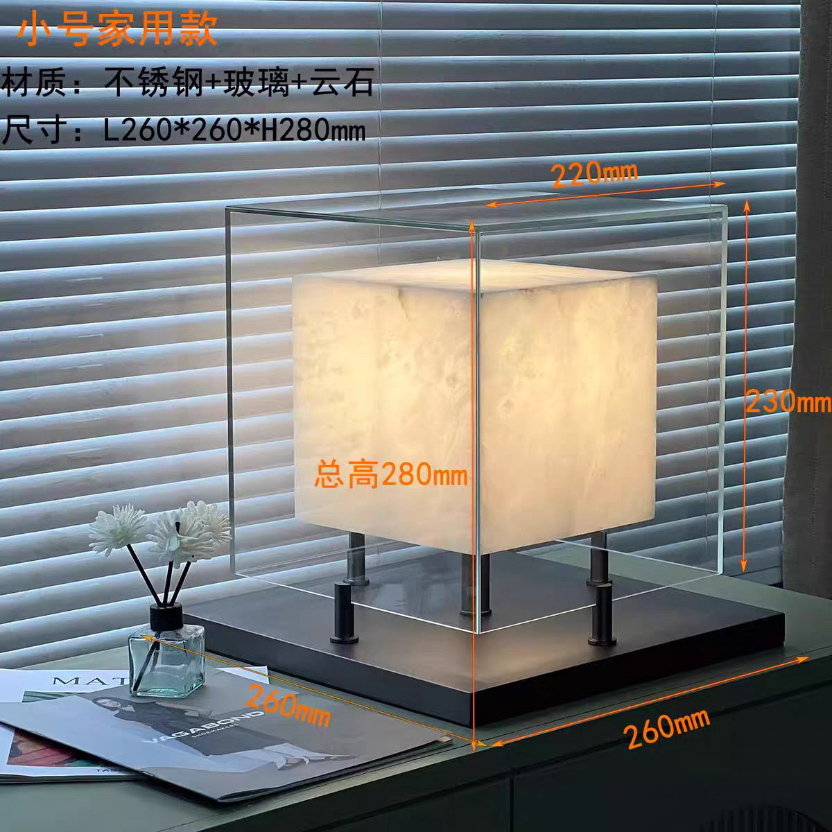 Small glass cube table lamp with glowing stone effect center