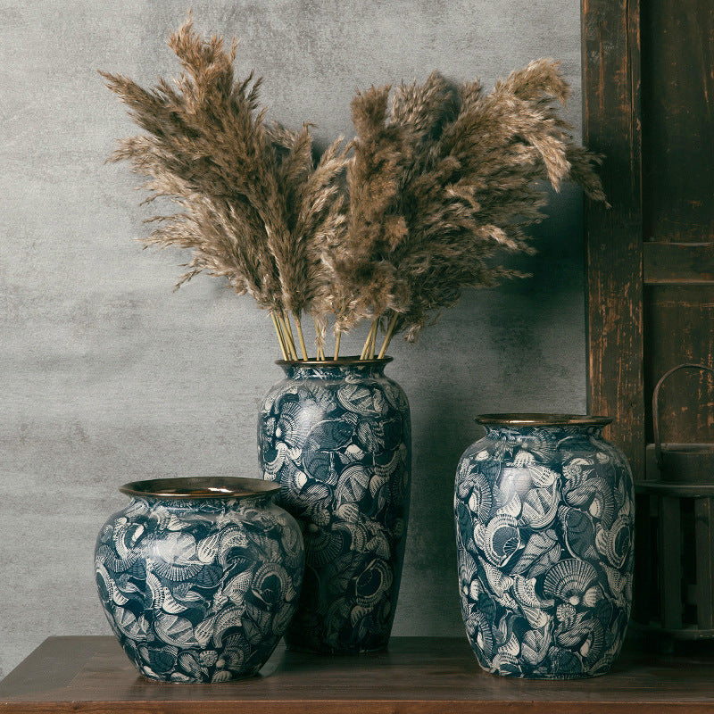 Three indigo marine-motif ceramic vases with pampas grass