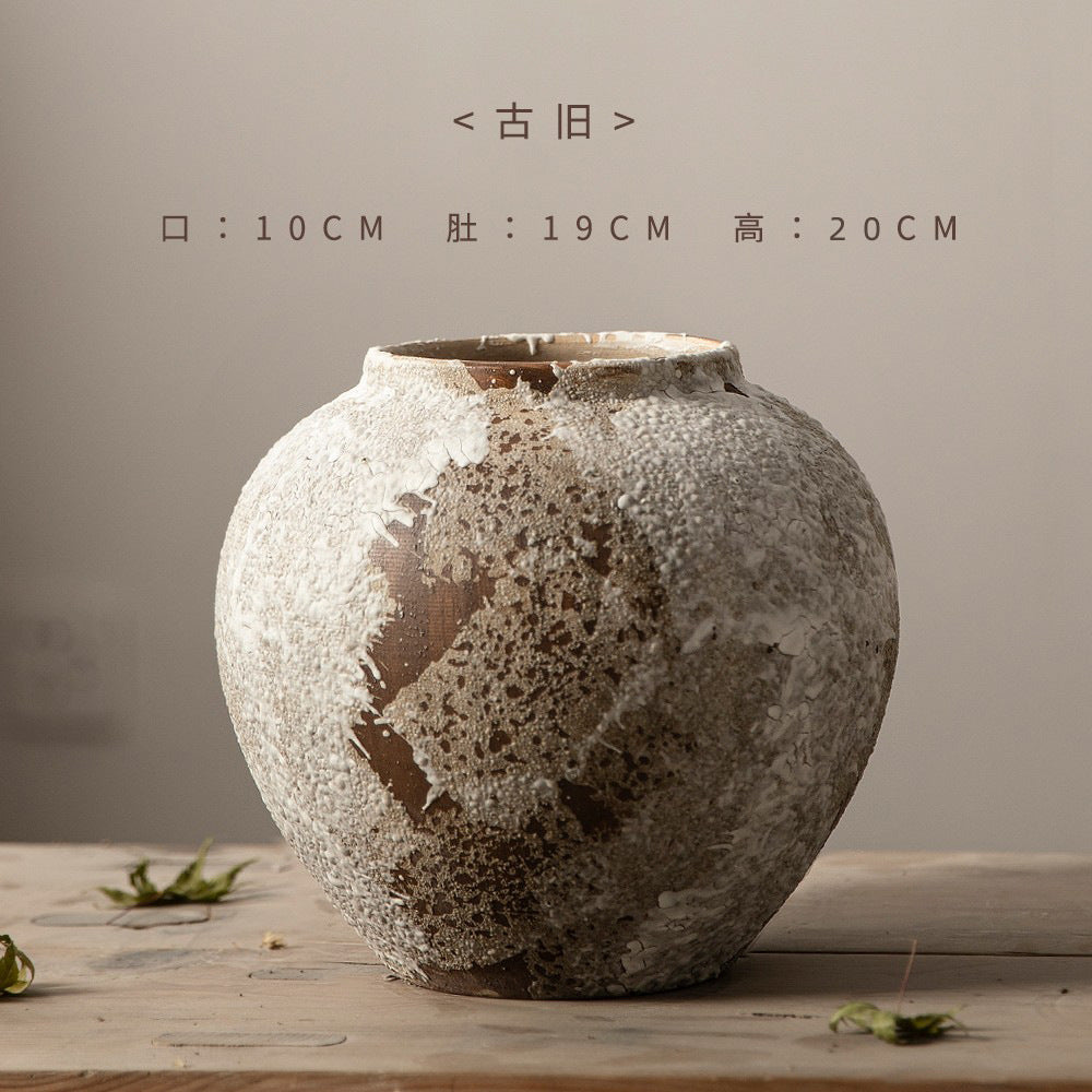 Small rounded weathered ceramic vase 20 cm high
