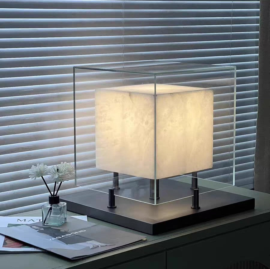 Large glass cube table lamp with warm stone-effect core in modern interior