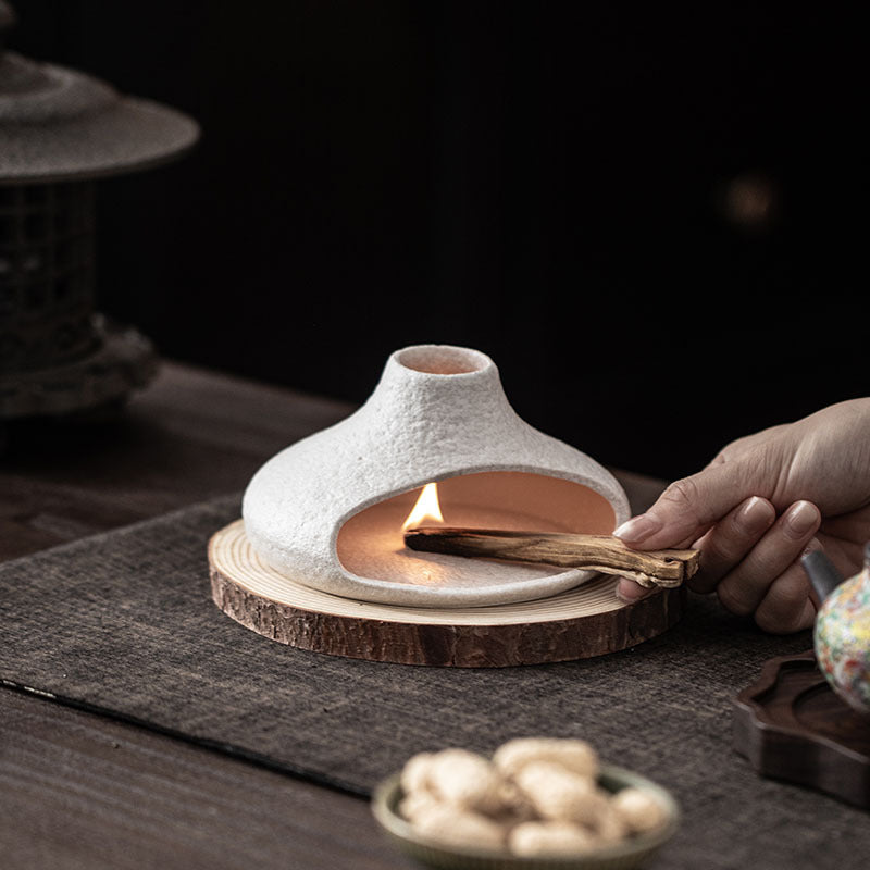 White oval chimney ceramic sage burner used on tea table