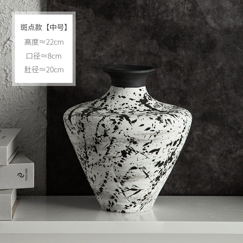 Medium black and white splatter ceramic shoulder vase approximately 22 cm high