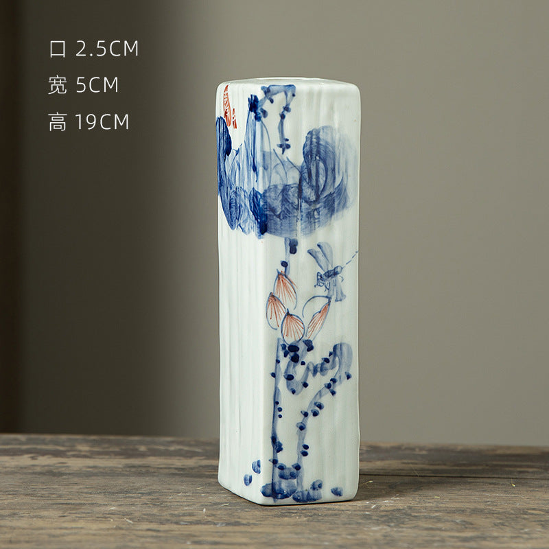 Hand-painted blue white rectangular ceramic bud vase with figure motif, 19 cm