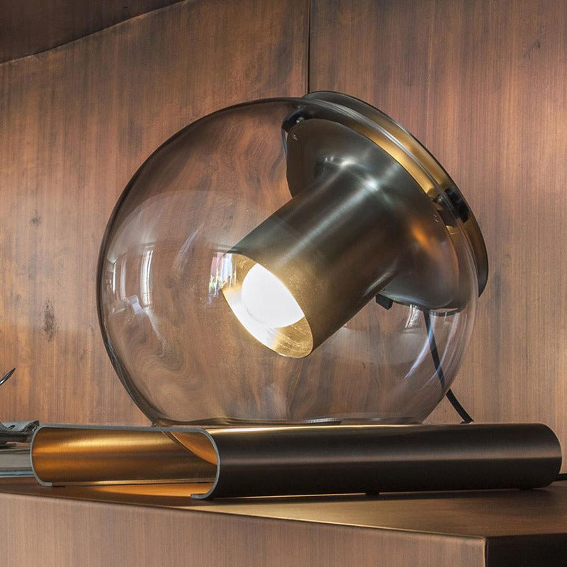 Sculptural glass sphere table lamp with adjustable spotlight detail