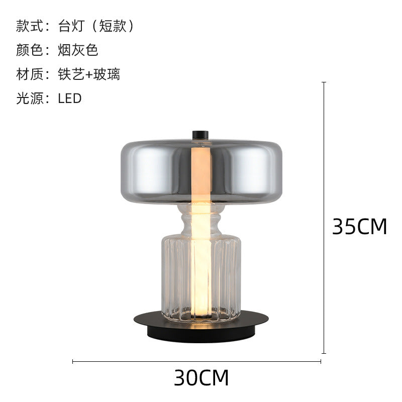 Smoke grey glass column bedside lamp close view