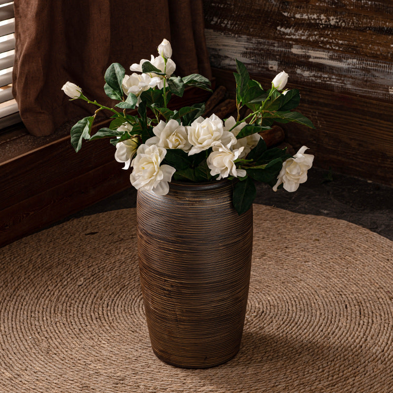 Bronze brown ribbed floor vase styled with white flowers