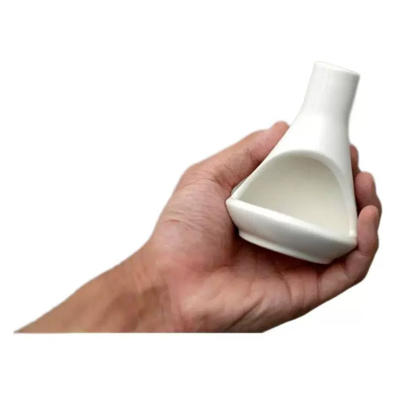 Compact cream white ceramic chimney Palo Santo burner shown in hand