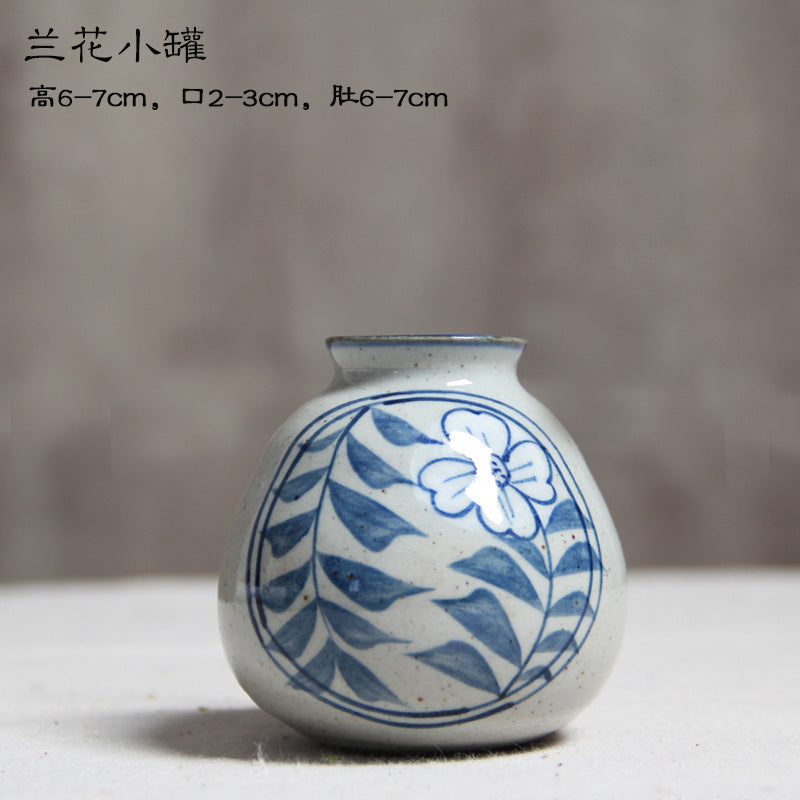 Hand-painted blue white mini ceramic vase with orchid motif, 6 to 7 cm