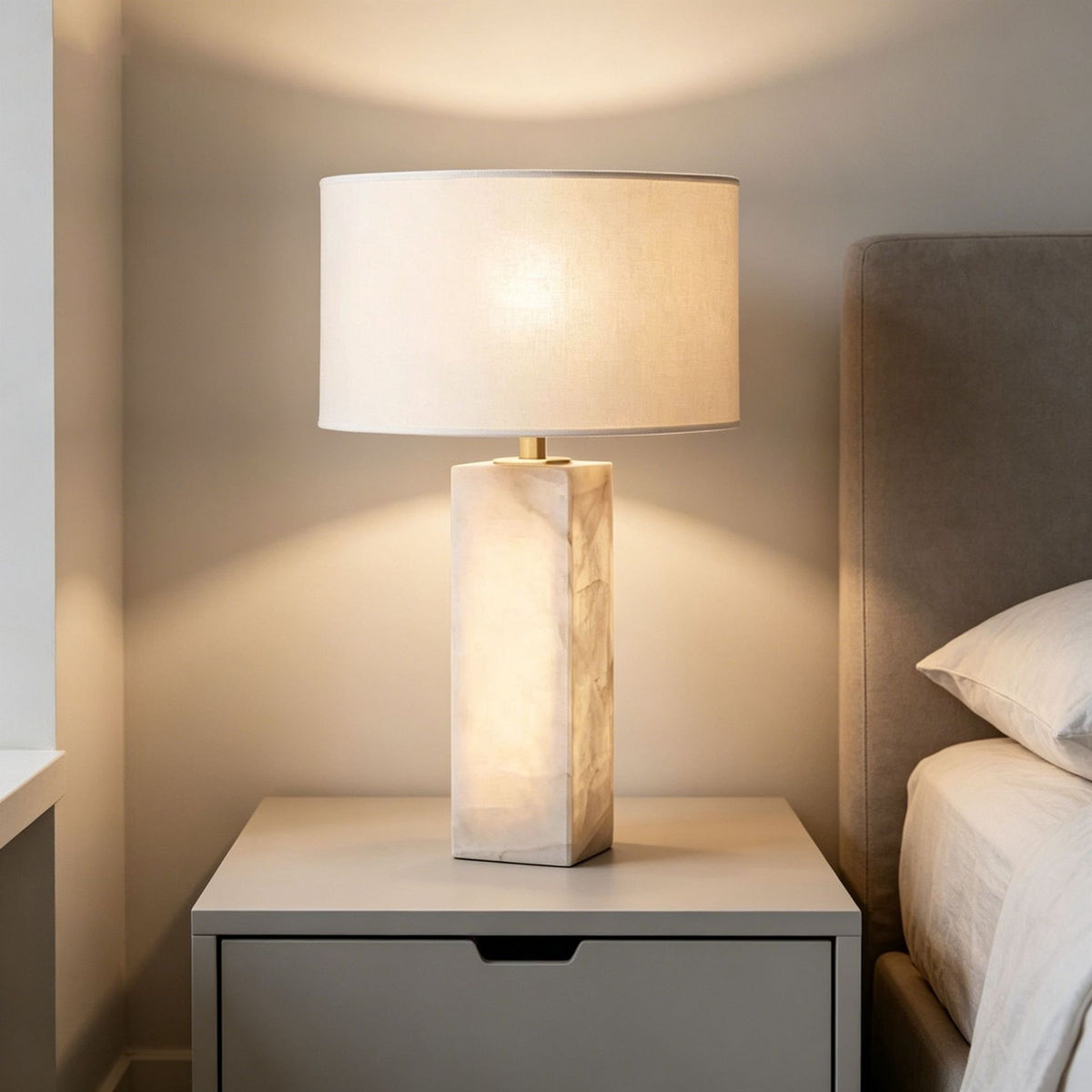 Cloud stone and copper table lamp styled on bedroom nightstand
