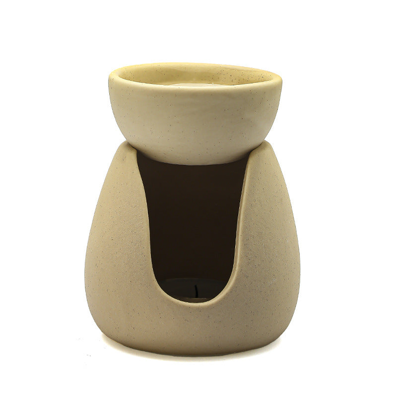 Two ceramic essential oil burners in cream yellow and black