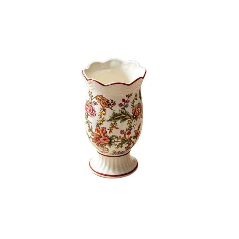 European floral ceramic vase with warm multicolor botanical pattern isolated view