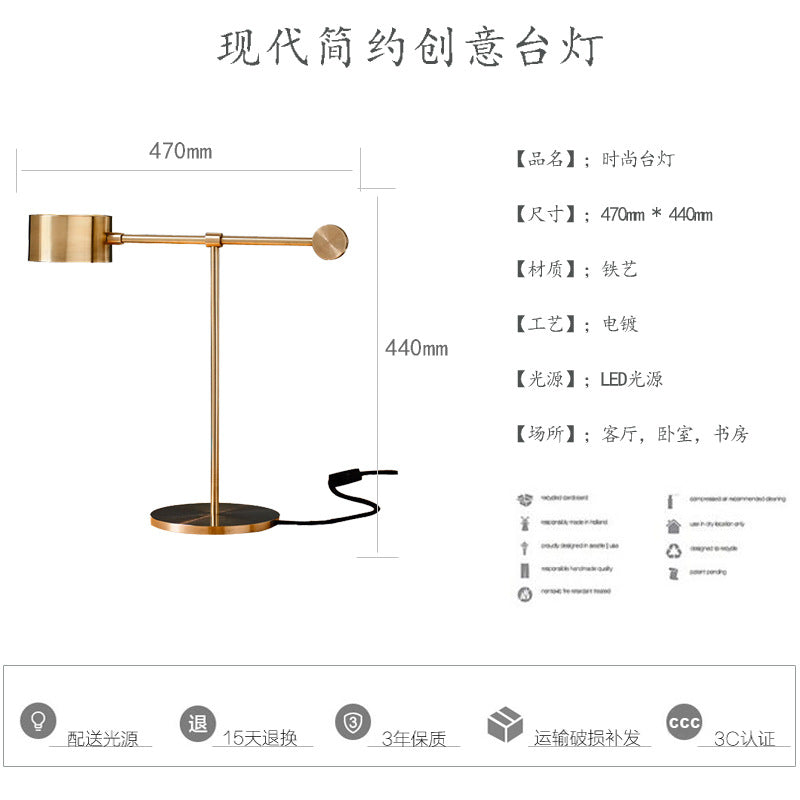 Modern Nordic gold reading desk lamp styled on dark desk