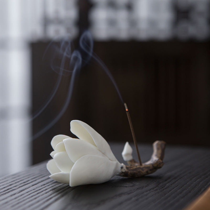 Magnolia ceramic incense holder burning a thin incense stick