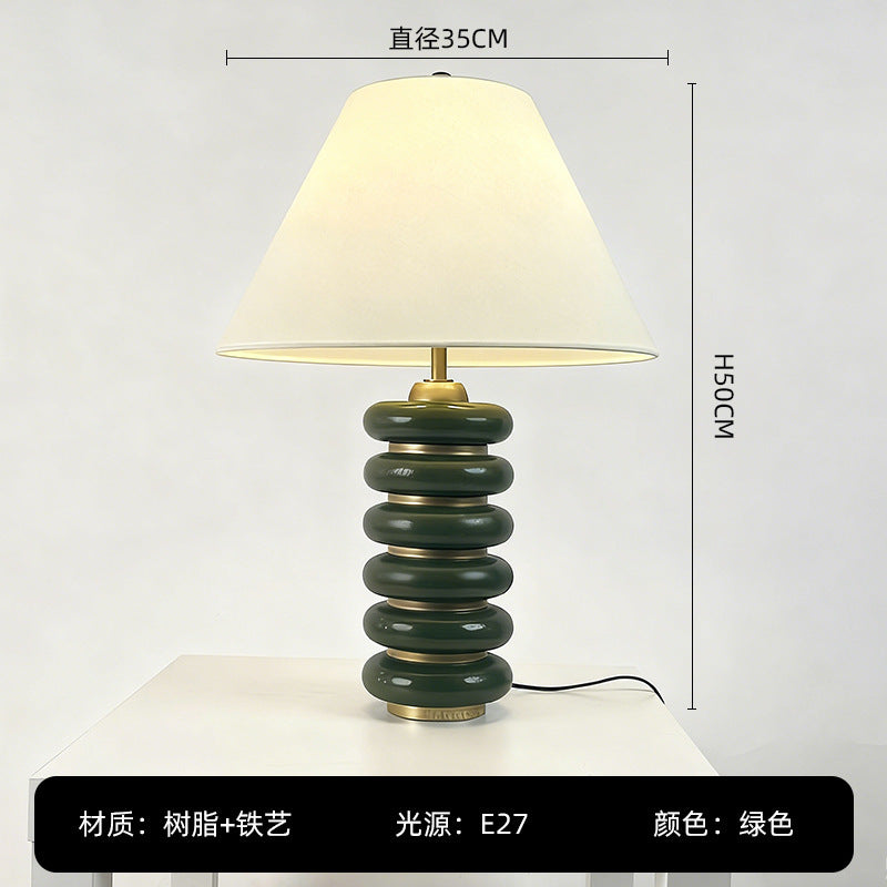 Green stacked disc resin table lamp 35cm by 50cm with tapered fabric shade