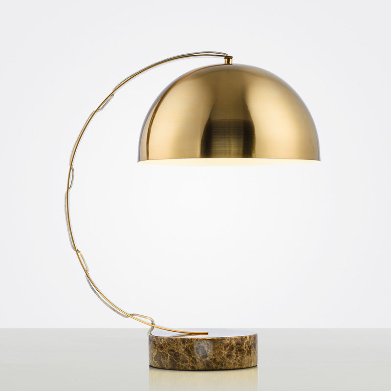 Sculptural gold arc dome table lamp with round brown marble base
