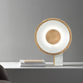 Gold halo ring LED table lamp with white marble base front view